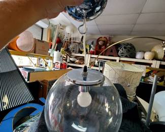 We are offering three beautiful vintage contemporary glass light fixtures.  The fixtures feature a 12" glass ball with steel accents and canopy.  These three fixtures are being sold together as a lot.  They are originally from a hotel in Los Angeles, most recently in the pool cabana area at the Hollywood Roosevelt Hotel.  