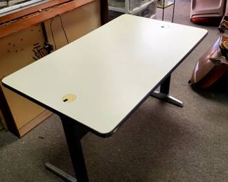 This desk has a solid steel/aluminum and a beige wood composite top.   This is the George Nelson Action Office Table, circa 1970. The desk offers a hidden pull-out basket drawer.  The leg design and desk dimensions is ideal for a keyboard.  