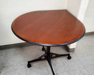 A fantastic find.  This Eames designed, Herman Miller 1970's teardrop table is quite special and in pristine condition.  The table has a solid steel base and a wood top, with black protective rubber on the edges.  It measures 42" X 36" and is 28" tall.  