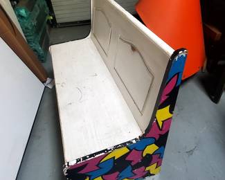 Selling this solid wood bench which features a fold up seat with storage space. The bench is painted white with the sides painted in a colorful motif of pink, yellow, teal, and black. It measures 44 3/8" x 19 1/2" x 33" tall at the back. Ideal for a childs playroom.