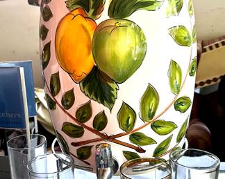 Large ceramic beverage dispenser with stainless steel stand. Like new. Max your summertime entertaining.