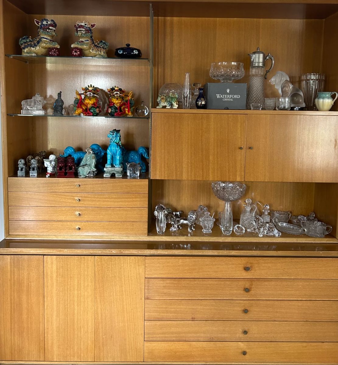 Lots of quality glass pieces, lion sculpture, and ceramic foo dogs