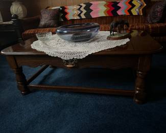 Matching coffee table for the 2 end stands.
In picture is the orange brown comfortable old couch on wheels - YES WHEELS AND WOODEN ARMS AS SEEN IN PICTURE.
Horse statue and Blue Bowl for sale
