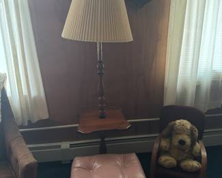Floor Lamp thru a wooden stand
Pink Ottoman
Child’s Red cloth Rocker