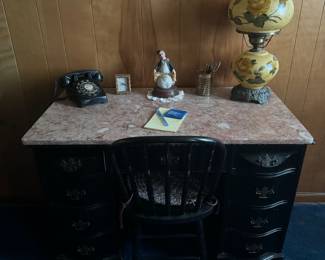 Mahogany desk w removable marble top
On desk is Old Fashion Dial UP Phone
Clown Sitting on the Top of the World- Hummel
Yellow Gone with the Wind Lamp.
Every thing on desk works