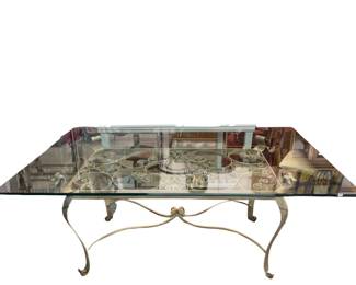 Glass top table, wrought iron base