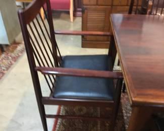 4 MCM Rosewood side dining chairs with black leather seats. Pair armchairs black leather seats.