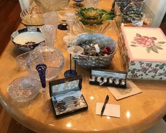 Large beautiful dining room table and a modern chandelier  