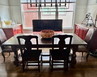 Pottery Barn farm table, 2 wooden side chairs, high backed bench on rollers and two “leather” side chairs