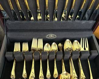 Gold toned International stainless 18/8 flatware for 12