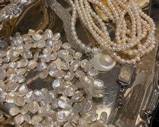 Large Collection of Pearl Jewelry Featuring Necklaces, Rings, and Bracelets