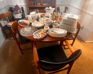Gorgeous dining room table with two leafs and chairs. Brought from Denmark.