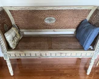 34. Carved Cane Settee (50" x 15" x 32")