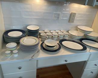 Such great and fun Kate Spade/Lenox porcelain dinnerware in spectacular condition!!
Set includes:
14 Dinner plates, 11", white with navy borders and a green rim. 
14 Salad plates, 9" White with bright multi primary colors, red, green, blue & yellow.
14 Fruit/Cereal Bowls,7", white inside, navy with a green rim, outer bowl. 
10 colorful coffee mugs
2 navy/white and green rim platters, 16" x 12" 
3 polka dot serving bowls, 10"
Sugar bowl
Salt and Pepper shaker set
