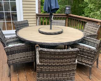 Dine in style with the Lorca dining set, featuring a woven top, and rotating lazy Susan. Crafted from durable wicker with a light tan and ebony finish, it's perfect centerpiece for your outdoor space. This Lorca Outdoor 11 piece Dining Set features Aluminum Frame with Synthetic UV Wicker, features Sunbrella fabric cushions and available in light Ebony finish color.
The ProShade umbrella features Sunbrella fabric and the stand is included. 
Set includes 67" round table with lazy susan and 8 arm chairs. While only 6 fit around the table, it's nice to have a couple extra chairs for friends who stop by to pull up.
Dimensions:  
Arm Chair: 23"w x 27"d x 34"h
67" Round Table:  67″w x 67″d x 30″h 