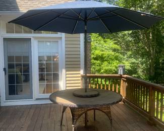 Dine in style with the Lorca dining set, featuring a woven top, and rotating lazy Susan. Crafted from durable wicker with a light tan and ebony finish, it's perfect centerpiece for your outdoor space. This Lorca Outdoor 11 piece Dining Set features Aluminum Frame with Synthetic UV Wicker, features Sunbrella fabric cushions and available in light Ebony finish color.

The ProShade umbrella features Sunbrella fabric and the stand is included. 

Set includes 67" round table with lazy susan and 8 arm chairs. While only 6 fit around the table, it's nice to have a couple extra chairs for friends who stop by to pull up.

Dimensions:  
Arm Chair: 23"w x 27"d x 34"h
67" Round Table:  67″w x 67″d x 30″h 