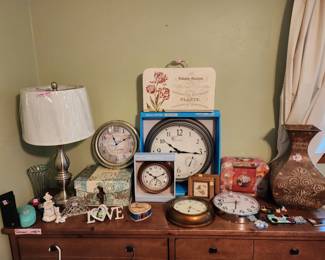 Clocks, lamps and vases