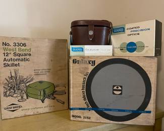 New in the box hassock fan, electric skillet, and Montgomery Wards binoculars 