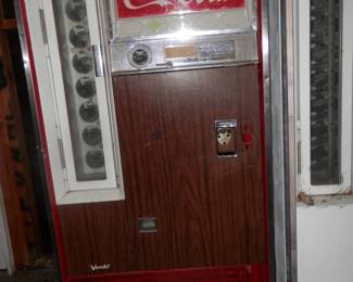 Early 1960's 10 cent, bottle dispensing Coca Cola Vending machine manufactured by "Vendo".  Working and cooling condition.