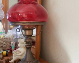 Vintage hurricane lamp....antiqued brass with beautiful ruby glass shade