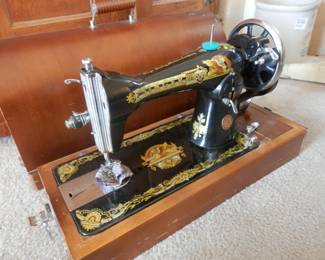 Unusually decorated Singer model 15 portable electric in bentwood case.
