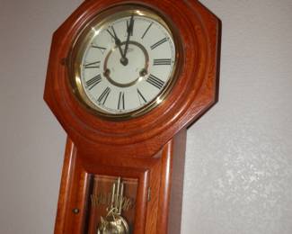 Nicely appointed regulator style wall clock...time and strike....needs overhall....recommend Kirks Valley clocks in El Cajon