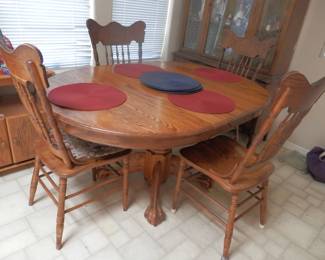 Oak barrel and claw foot table....shown with 2 leaves.   4 pressed back Victorian chairs
