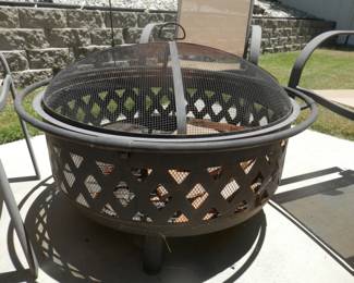 Outdoor patio fire pit surrounded by 4 chairs