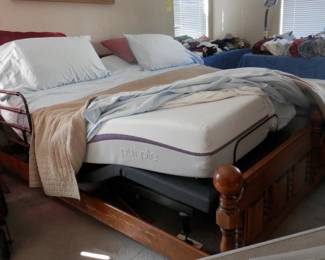 Pair of adjustable beds....one in this photo has the infamous "PURPLE" mattress.....each bed has seperste remote control and super quiet motorization....the 2 together make 1 Cal King