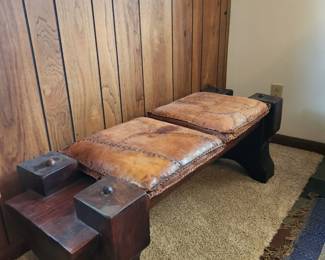 Bench with its original leather stitched cushions