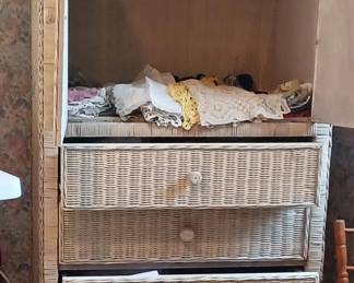 Doilies in a wicker wardrobe
