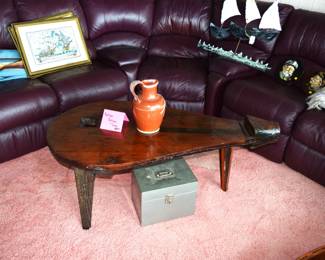 Leather sectional and a bellows table