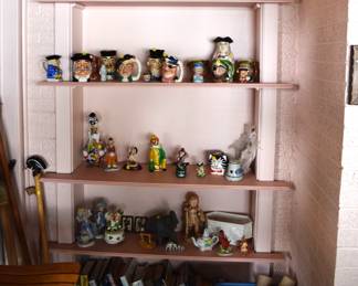 Lots of odd and ends with books and antique wall paper