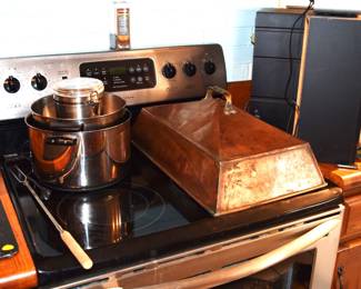 That is a copper two burner cover from an old wood cook stove