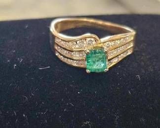 Emerald and diamond ring set in 14 kt..we have certs for this 