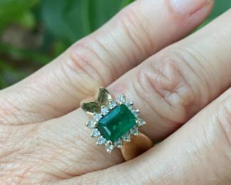 $275- Emerald cut center stone 1ct approx, on 14kt yellow gold setting ring SZ 6