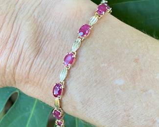 #66 - $550- 7 1/2" -14kt yellow gold & ruby bracelet -6.7 grams.