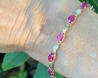 #66 - $550- 7 1/2" -14kt yellow gold & ruby bracelet -6.7 grams.