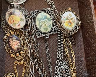 Hand painted porcelain medallion necklaces, brooch, rings.
