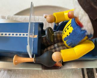 #25 - $58 German Steinbach handcrafted painted man in car 12x9 - music box - working - tiny chip on on dashboard