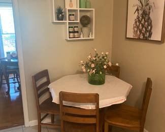 Cafe table and chairs
Solid wood 
Table dimensions H-28” top 36” octagon shape. Top is unfinished. Would need a tablecloth. 