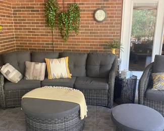 Outdoor rattan furniture. 
2 swivel chairs, sofa and 2 ottoman’s. 