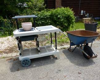 Garage completely loaded with stuff including tool chests, tool boxes, hand tools, power tools, garden tools, lawn mowers, trimmers, ladders, compressor, decorations, new sinks in boxes, carts, sleds, snowboards, pails and much more!!