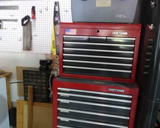 Garage completely loaded with stuff including tool chests, tool boxes, hand tools, power tools, garden tools, lawn mowers, trimmers, ladders, compressor, decorations, new sinks in boxes, carts, sleds, snowboards, pails and much more!!
