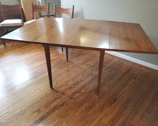 Sleek MCM lines show off the Lane dining table. (2) leaves shown (1) other on this drop leaf table.  Excellent condition.