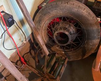 Antique garden tillers and '30s spoke wheel tire