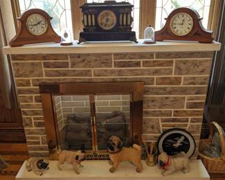 Fireplace, Pugs and clocks.  Fireplace is very heavy, measures 5' long 3' 5" tall 1' 1" wide the hearth is not attached, but is included $150