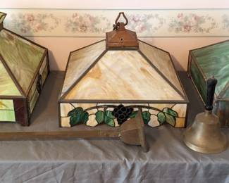 I just adore these stained glass vintage light fixtures.  Two, the middle and the one on the right, are missing a back panel. 