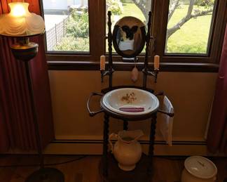 An electrified Aladdin Lamp, and vintage "bathroom".