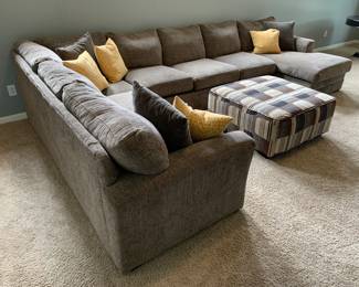 Sectional Sofa and Ottoman. One foot of the couch detaches when lifted but stays fine when in place. There is some damage to upholstery on chaise lounge from dog scratching.